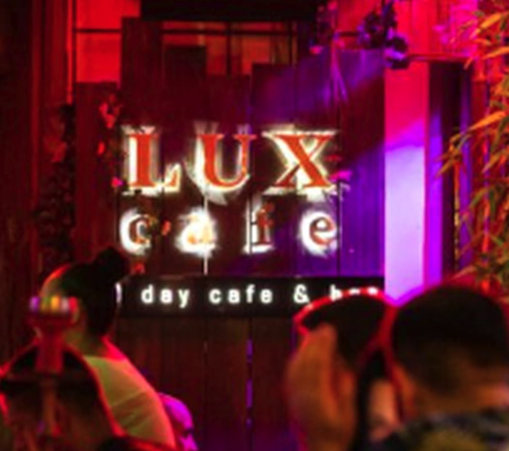 LUX Cafe illuminated sign and nightlife atmosphere